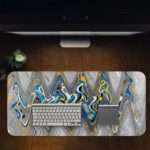 Infidu Artistic Desk Pad with a fluid, wavy pattern in blue, white, yellow, and gray, covering the entire surface. Desk Pad in computer table