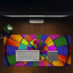 Infidu Artistic Patterns Desk Pad features a striking circular pattern with colorful segments in green, red, blue, and yellow. Desk Pad in computer table