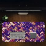 Infidu Artistic Patterns Desk Pad with a purple and pink wavy pattern, accented with white and dark red zigzag lines. Desk Pad in computer table