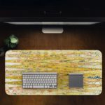 Infidu Artistic Patterns Desk Pad with a yellow and light brown background and vibrant abstract patterns in orange, green, and white. Desk Pad in computer table