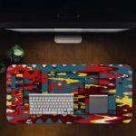 Infidu Artistic Patterns Desk Pad features a colorful abstract design with blue, red, yellow, and black layered shapes and lines. Desk Pad in computer table