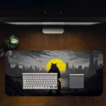 Infidu Artistic Desk Pad with a shadowy anthropomorphic cat or wolf riding a bicycle against a city skyline and a large yellow moon. Desk Pad in computer table