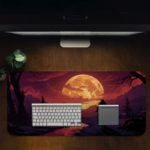 Infidu Desk Pad with a silhouette of a person on horseback by water, set against a sunset sky in deep purples, pinks, and oranges. Desk Pad with Keyboard and Mouse