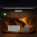 Infidu Space Desk Pad features a rocky planet with a dramatic sun against a swirling orange and yellow sky. Desk Mat with a laptop