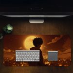 Desk pad featuring an anime-style silhouette of a person facing a glowing full moon with a nighttime cityscape background in warm colors. Desk Pad in computer table