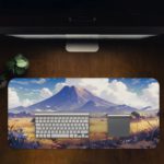 Desk pad with a serene mountain landscape, snowy peaks, blue sky, and desert terrain. Desk Pad in computer table