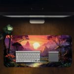 Desk pad with a tranquil lake, colorful sky, and silhouetted trees, featuring vibrant shades of orange, purple, and blue. Desk Pad in computer table