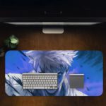 Desk pad featuring a manga-style anime character with white hair and a serious expression on a vibrant blue background. Desk Pad in computer table