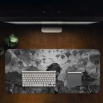 Desk pad featuring a ninja anime boy with a background of traditional Asian architecture and floating lanterns in grayscale. Desk Pad in computer table