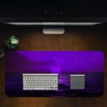 Tranquil ocean scene in purple twilight with gentle waves and a distant silhouette, creating a dreamy atmosphere. Desk Pad in computer table