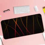 Golden curved lines crisscrossing on a black background, create a dynamic and elegant abstract design. Desk Pad with Keyboard and Mouse