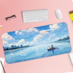 Man rowing a boat on calm water with a bright blue sky and fluffy white clouds reflecting below. Desk Pad with Keyboard and Mouse