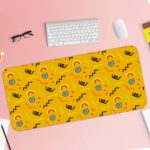 Desk pad with a bright yellow background featuring black curved lines and blue circular shapes. Desk Pad with Keyboard and Mouse