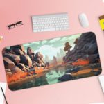 Rocky coastal scene with cliffs, boulders, and a flowing river in earthy oranges and cool blues. Desk Pad with Keyboard and Mouse