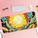 Infidu Color Wave Boom Animated Desk Pad with a bright sun, rocky landscape, and bold red, blue, yellow, and gray colors in a comic-style design. Desk Pad with Keyboard and Mouse