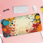 Infidu Color Splash Animated Desk Pad featuring a bubble-like pattern with red, blue, and orange colors on an abstract, marbled background. Desk Pad with Keyboard and Mouse