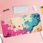 Infidu Color Splash Animated Desk Pad featuring a bubble-like pattern with pink, blue, and orange colors on an abstract, marbled background. Desk Pad with Keyboard and Mouse