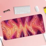 Infidu Artistic Animated Desk Pad with a swirling marbled pattern in pink, white, and red. Desk Pad with Keyboard and Mouse