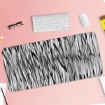 Infidu Artistic Patterns Desk Pad with vertical black and white lines creating a dense, forest-like pattern and optical illusion effect. Desk Pad with Keyboard and Mouse