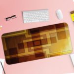 Infidu Artistic Patterns Desk Mat featuring a layered design of overlapping squares and rectangles in warm neutral tones like brown and beige. Desk Pad with Keyboard and Mouse