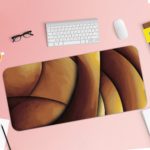 Infidu Artistic Patterns Desk Mat featuring a smooth, curvy abstract design in soft beige, light brown, and pinkish tones. Desk Pad with Keyboard and Mouse