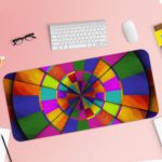 Infidu Artistic Patterns Desk Pad features a striking circular pattern with colorful segments in green, red, blue, and yellow. Desk Pad with Keyboard and Mouse