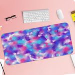 Infidu Artistic Patterns Desk Pad with a multi-colored speckled design in blue, pink, purple, and white, resembling a watercolor effect. Desk Pad with Keyboard and Mouse