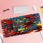 Infidu Artistic Patterns Desk Pad features a colorful abstract design with blue, red, yellow, and black layered shapes and lines. Desk Pad with Keyboard and Mouse