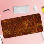 Infidu Artistic Patterns Desk Pad with deep red and orange background and textured abstract designs. Desk Pad with Keyboard and Mouse