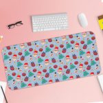 Infidu Christmas Desk Pad with playful snowflakes, Christmas trees, and ornaments on a light blue background. Desk Pad with Keyboard and Mouse