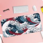 Infidu Artistic Desk Mat with Japanese Ocean vector art in blue and red waves on a white background. Desk Pad with Keyboard and Mouse