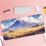 Desk pad with a serene mountain landscape, snowy peaks, blue sky, and desert terrain. Desk Pad with Keyboard and Mouse