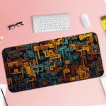 Infidu desk pad with a complex, maze-like pattern in brown, orange, and teal tones. Desk Pad with Keyboard and Mouse