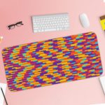 Infidu Artistic Desk Pad with a colorful mosaic pattern of red, yellow, blue, purple, and orange blocks arranged diagonally. Desk Pad with Keyboard and Mouse