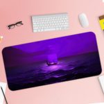 Tranquil ocean scene in purple twilight with gentle waves and a distant silhouette, creating a dreamy atmosphere. Desk Pad with Keyboard and Mouse