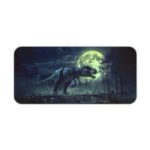 Godzilla rises over a city at night with a white moon and clouds on a desk mat. Desk Pad kept on a plain white background