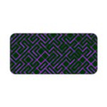 Dark desk pad with a geometric pattern of maze-like black and purple lines, adds a stylish touch to your workspace. Design Kept on a computer table