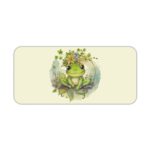 Desk pad with a playful frog design and a yellow flower on a white background. Desk Pad kept on a plain white background