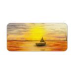 Desk mat featuring a sunset scene with a silhouette of a sailboat on an orange-gold sea, under a warm yellow and golden sky. Desk Pad kept on a plain white background