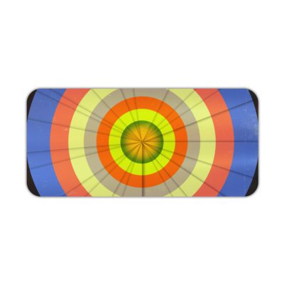 Infidu Artistic Desk Mat with circular pattern and concentric rings in orange, yellow, blue, and green. Desk Pad kept on a plain white background