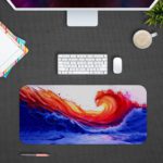 Bright orange and red curling wave against a deep blue background. Design Kept on a computer table