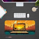 Infidu Tech Fusion with Laptop Desk Pad featuring a laptop against a dramatic background of orange and yellow clouds. Desk Pad kept on a plain gray background