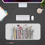 Infidu Vintage Books Animated Desk Pad with White Background and Colorful Flower Desk Pad kept on a plain gray background