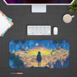 Desk pad showing a person standing on a ledge, overlooking a cityscape at sunset with blue and yellow tones, silhouetted against the sky. Design Kept on a computer table