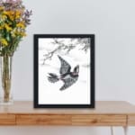 vintage art print of the Hondo Great Spotted Woodpecker by Numata Kashu, kept on a table