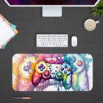 Gaming desk pad with a multi-colored controller on a white background, featuring vibrant paint splashes desk Pad with Antique Video Game Desk Pad on computer table