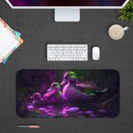 Artistic desk pad with a glowing duck family in purple and green on a dark background with water reflections. Desk Pad kept on a gray background