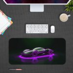 Desk pad featuring a sleek, futuristic sports car in glowing purple neon against a dark background. Design Kept on a computer table