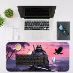 Infidu Artistic Desk Pad with an anime samurai in meditation against a purple and pink sunset sky, with silhouettes of trees, mountains, and a soaring bird. Desk Mat with an Apple Laptop