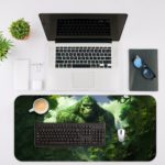 Kong with a natural sky background desk pad featuring clouds, designed for both kids and adults. Desk Mat with an Apple Computer